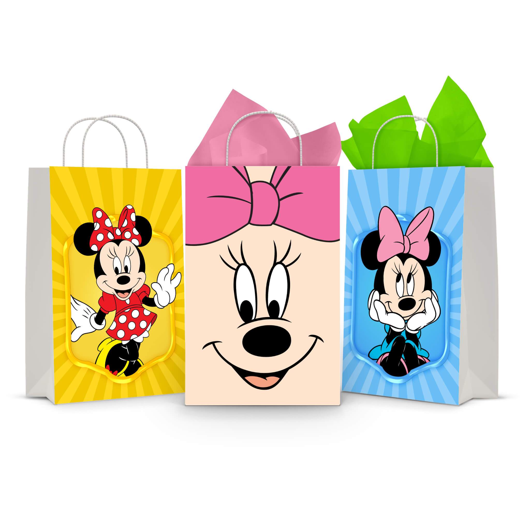 Three printable Minnie Mouse goodie bag fronts on paper party bags — Minnie waving in her red polka-dot dress on yellow, a big close-up of her face with the pink bow, and Minnie with her hands on her cheeks on blue.