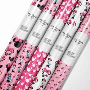Roll of official Minnie Mouse wrapping paper featuring classic polka dot design.