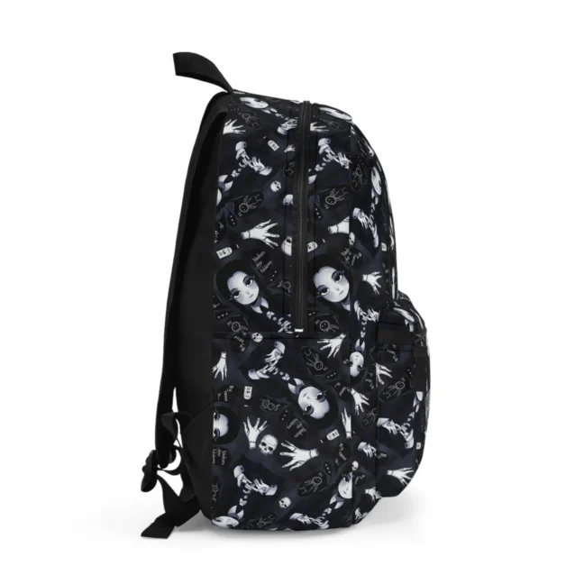 Detailed side shot of the dark alternative skulls and ravens fabric pattern on our custom personalized Wednesday Addams school bag.
