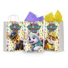 Three printable Paw Patrol goodie bag fronts on paper party bags — Chase the police pup, Everest the snow pup and Rubble the construction pup, each under the PAW PATROL badge on a paw-print background.