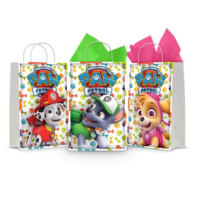 Three printable Paw Patrol goodie bag fronts on paper party bags — Marshall the fire pup, Rocky the recycling pup and Skye the aviator pup, each under the PAW PATROL badge on a paw-print background.