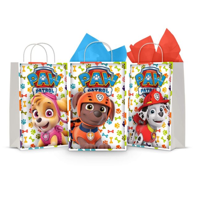 Three printable Paw Patrol goodie bag fronts on paper party bags — Skye, Zuma the water-rescue pup and Marshall, each under the PAW PATROL badge on a paw-print background.