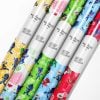 Roll of vibrant PJ Masks wrapping paper featuring Catboy, Owlette, and Gekko.