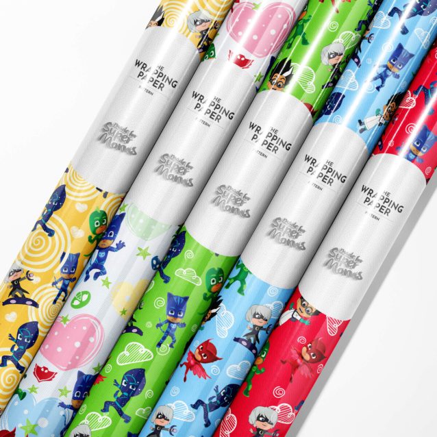 Roll of vibrant PJ Masks wrapping paper featuring Catboy, Owlette, and Gekko.