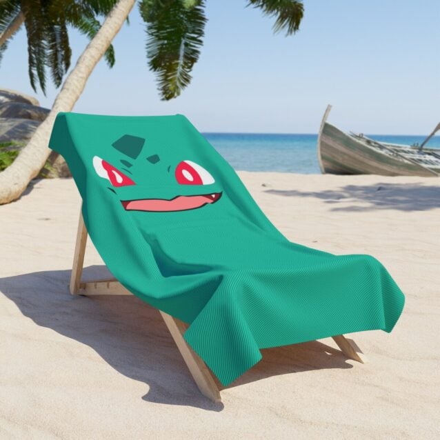 Folded Bulbasaur swim towel with a custom printed name, a soft terry summer essential.