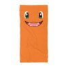 Laid flat, a Charmander beach towel with the printed name on soft quick-dry terry.