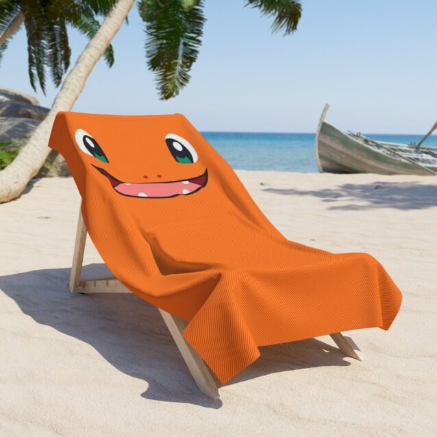 Draped Charmander pool towel in quick-dry terry, personalized with your child's name.