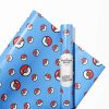 Vibrant Pokemon wrapping paper showcasing a battle scene with Charizard.