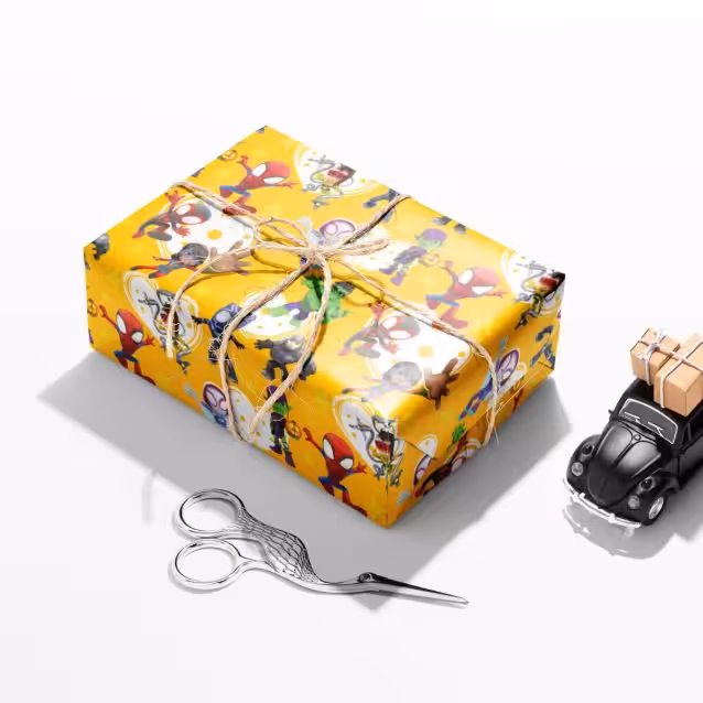 Ghost-Spider in a heroic pose on the kids birthday wrap.