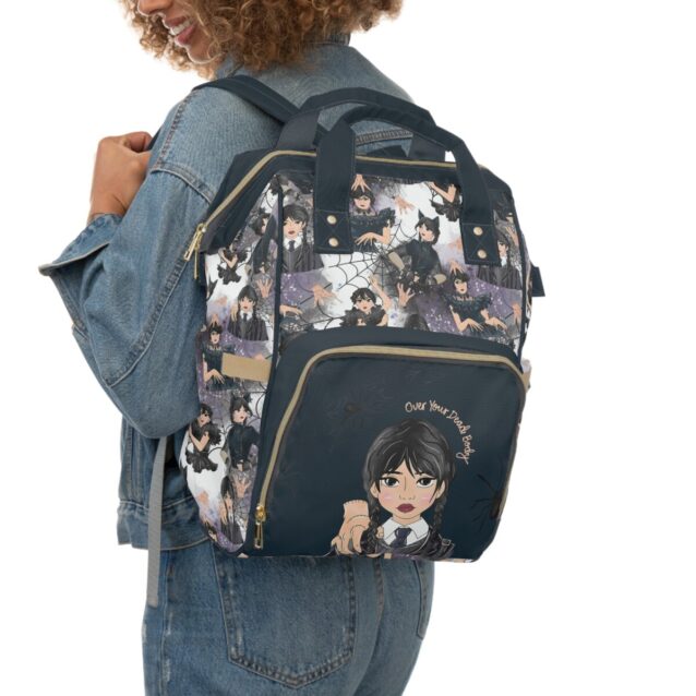 Wednesday Addams diaper bag worn as a backpack, spooky-cute Nevermore artwork.
