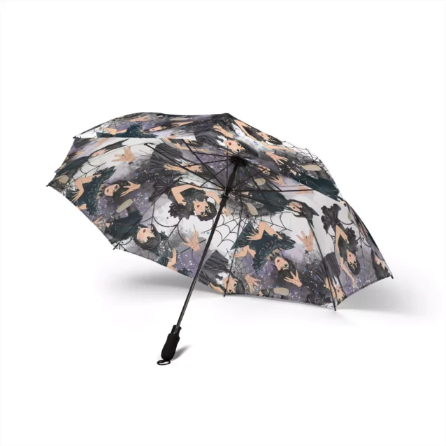The soft foam handle of the Wednesday Addams umbrella, held in one hand.
