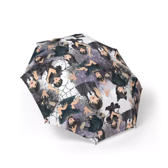 Wednesday Addams Nevermore Collage (Grey) umbrella held open in the rain.