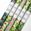 Close-up of glossy finish on The Grinch Christmas Wrapping Papers with Whoville design.