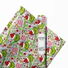 A neatly wrapped Christmas gift using The Grinch Christmas Wrapping Papers.