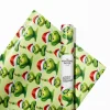 Action scene of The Grinch and his sleigh on high-quality wrapping paper.