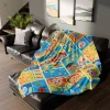 Child holding a Cocomelon fleece blanket with their name printed on it.