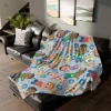 Cozy blue fleece blanket with playful Cocomelon characters, a fun and cuddly gift for kids.