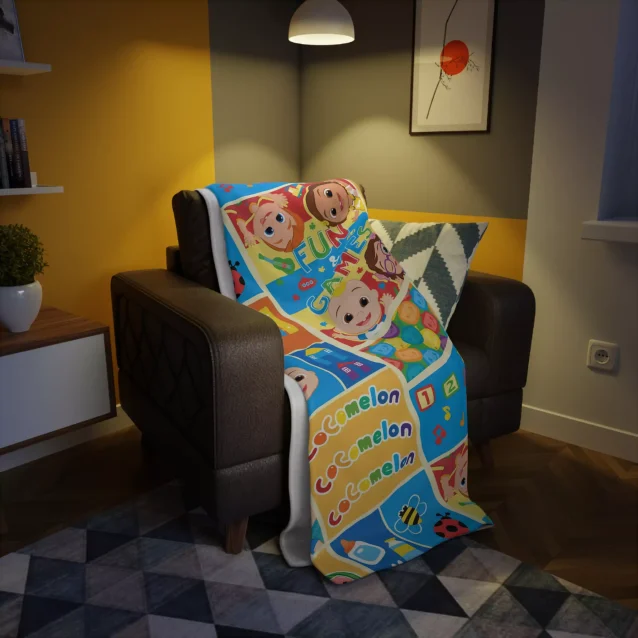The Cocomelon fleece blanket displaying colorful characters from the show.
