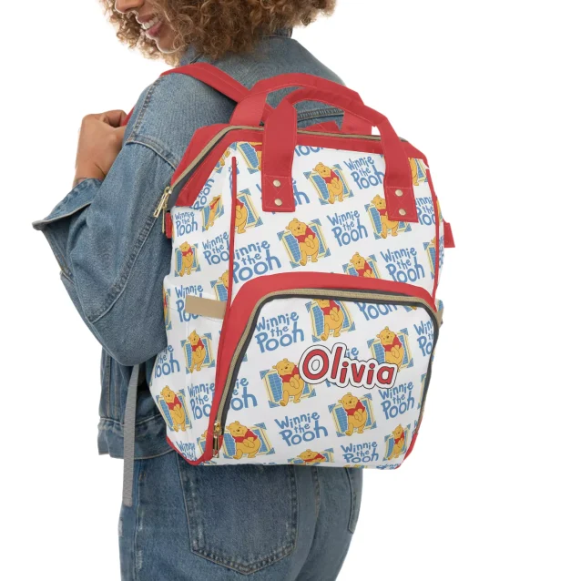 Bright red backpack diaper bag with everyone's favorite honey-loving bear.