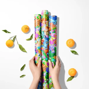 Roll of Animal Crossing wrapping paper featuring Isabelle and Tom Nook.