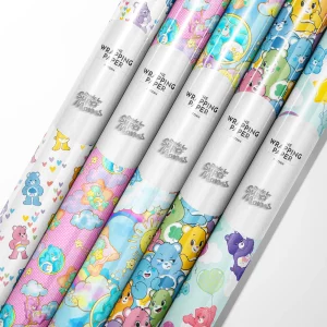 Close-up of a gift wrapped in glossy Care Bears Wrapping Paper with Funshine Bear design.
