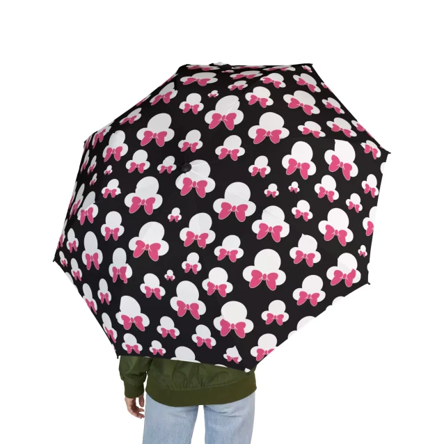 A close-up of the Minnie Mouse character design on the umbrella's canopy.
