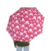 The Minnie Mouse umbrella standing open to dry after a downpour.