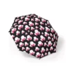 A Minnie Mouse umbrella printed with the Minnie Heads on Black artwork.