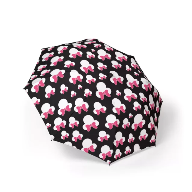 A Minnie Mouse umbrella printed with the Minnie Heads on Black artwork.