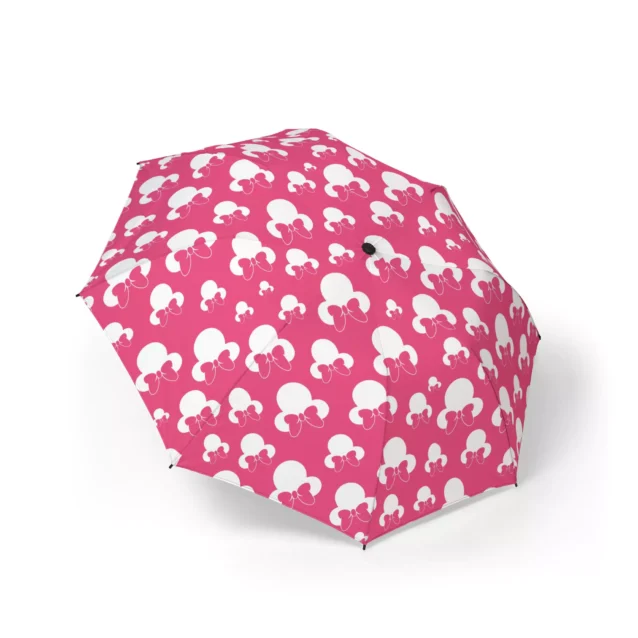 Minnie Mouse umbrella in the Minnie Heads on Pink design, canopy fully open.