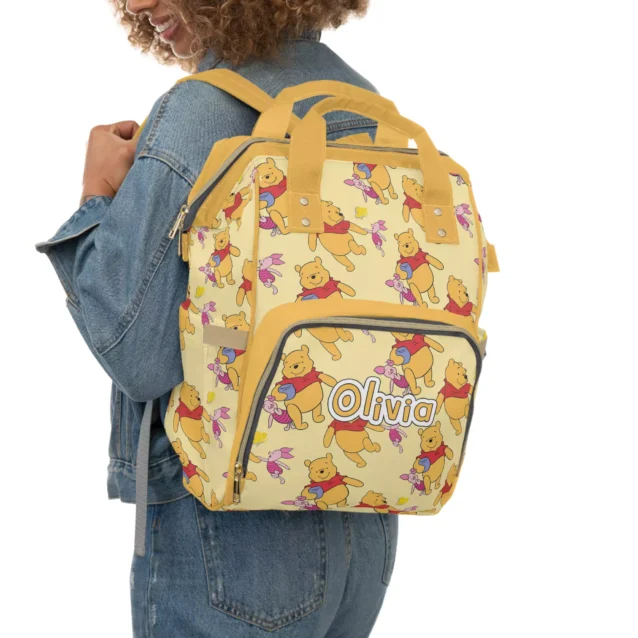 Functional backpack diaper bag featuring classic Winnie the Pooh.