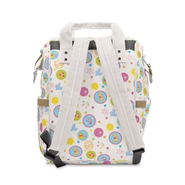 Crisp white backpack diaper bag featuring everyone's favorite honey bear.