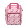 Pink Piglet diaper bag backpack with daisies and "Love" lettering, the baby's name printed on the pocket.