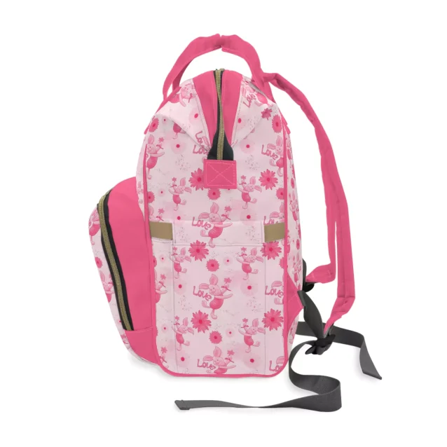 Keep your baby's essentials organized in style with this pink Winnie the Pooh diaper bag.