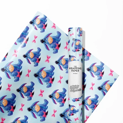 Gift wrap featuring Winnie the Pooh characters with a blue background.