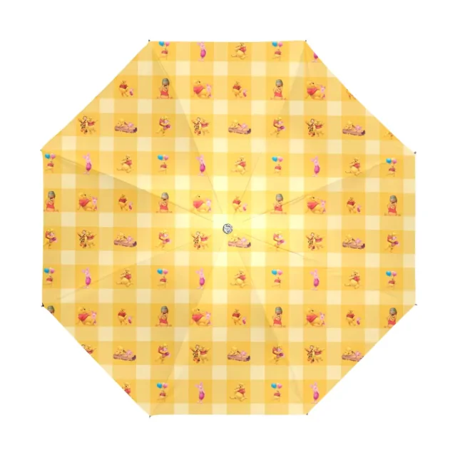 Pooh Bear prepares for puddles with his compact, collapsible umbrella.