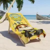Kids' beach towel in sunshine yellow with an image of Rubble, the construction pup from Paw Patrol. Personalize it for a pawsome beach day!