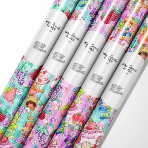 Multiple rolls of Strawberry Shortcake birthday wrapping paper in different sizes.