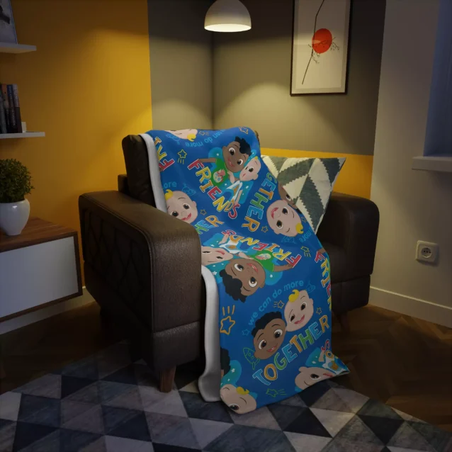 Perfect for bedtime or playtime, this Cocomelon dark blue fleece throw blanket is a huggable favorite for young fans.