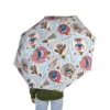 Sheltering under the Lilo & Stitch Christmas umbrella on a wet day.