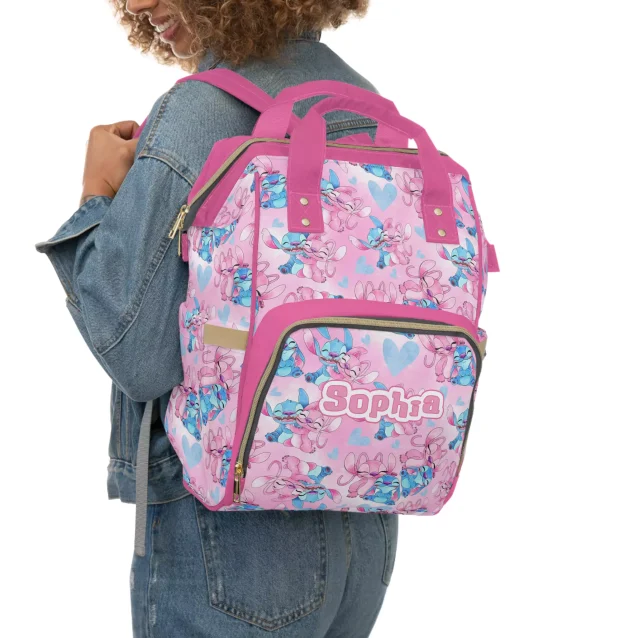White and pink diaper bag featuring Stitch and Angel from Disney's Lilo & Stitch.