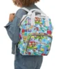 Snoopy Peanuts diaper bag worn as a backpack for hands-free carrying.