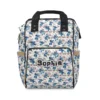 Cream Stitch doodle diaper bag with dense blue Stitch art and black handles.