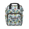 Pastel mint and yellow Stitch diaper bag with Stitch and Scrump doodle scenes and black handles.