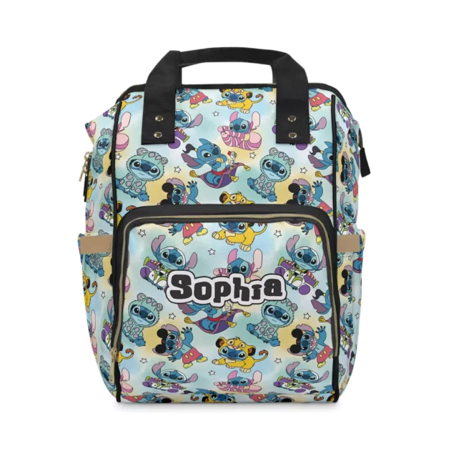 Pastel mint and yellow Stitch diaper bag with Stitch and Scrump doodle scenes and black handles.