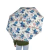 The Stitch umbrella standing open to dry after a downpour.