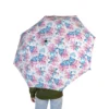 Side view of the Stitch umbrella, canopy open and taut.