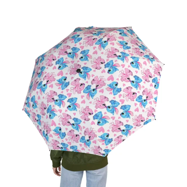 A hand lifting the Stitch umbrella out of a school bag.