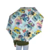 A child carrying the Stitch umbrella on the way to school.