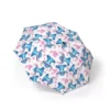 Stitch Stitch Solo (White) umbrella held open in the rain.
